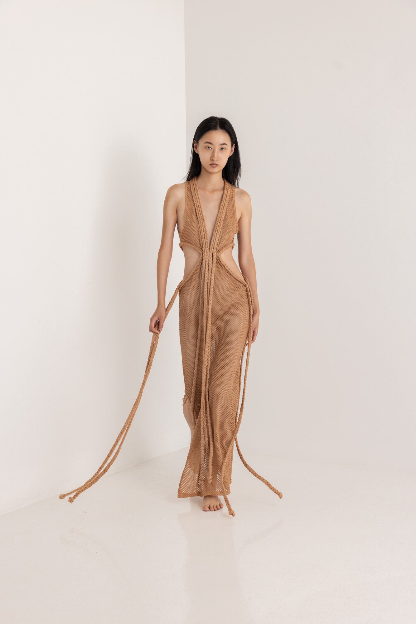 rihanna brown silk dress Racy display: The leggy lady was daring with her long legs on show in the short evening nu